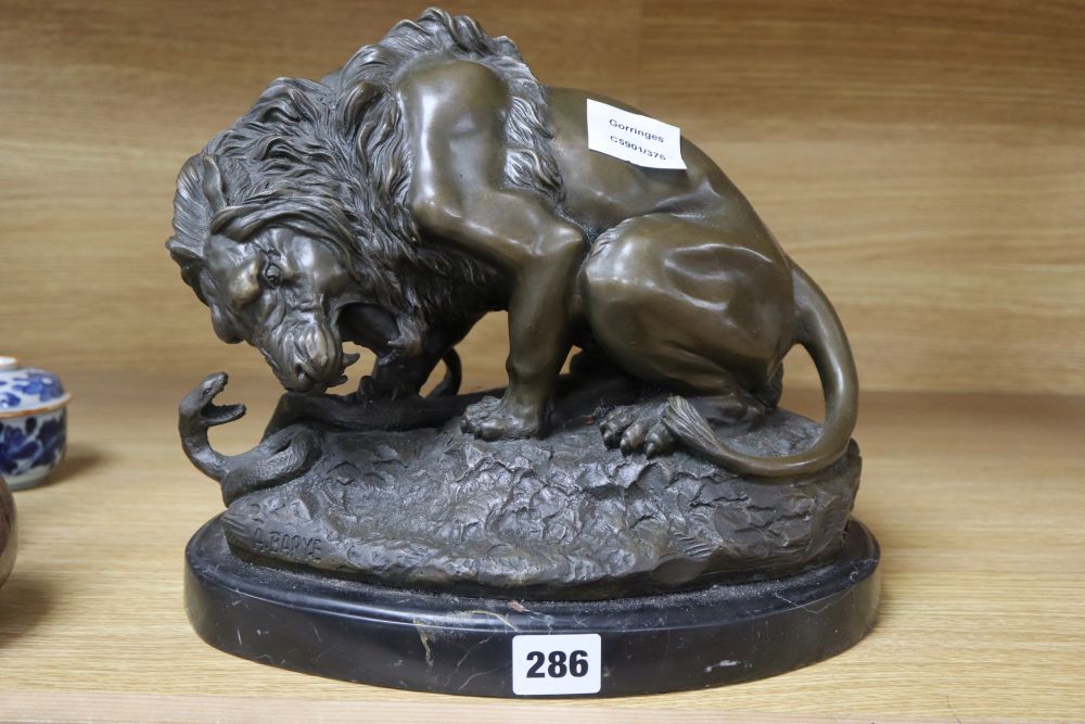After A. Barye. A bronze of lion and a snake, height 24cm